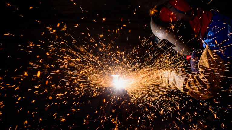 Gouging welding steel structure and bright sparks in steel construction industry