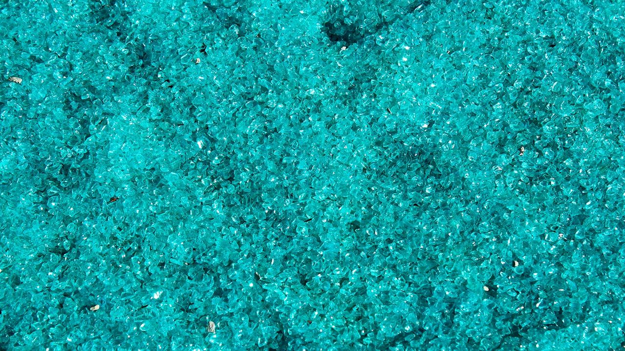 Blue glass particles