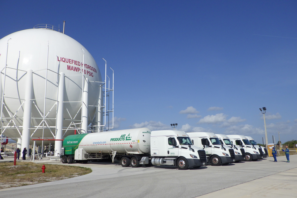 Air Products' hydrogen trucks in front of liquid hydrogen sphere at NASA's Kennedy Space Center